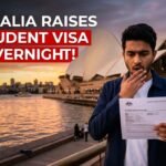 Shocked international student holding Australia Student Visa document after fee increase from $2000 to $2500 in 2026, with Sydney Opera House in background